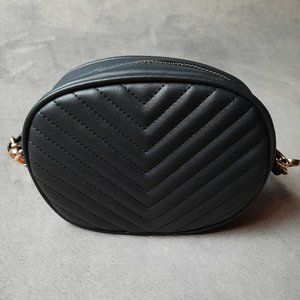 Small black handbag.